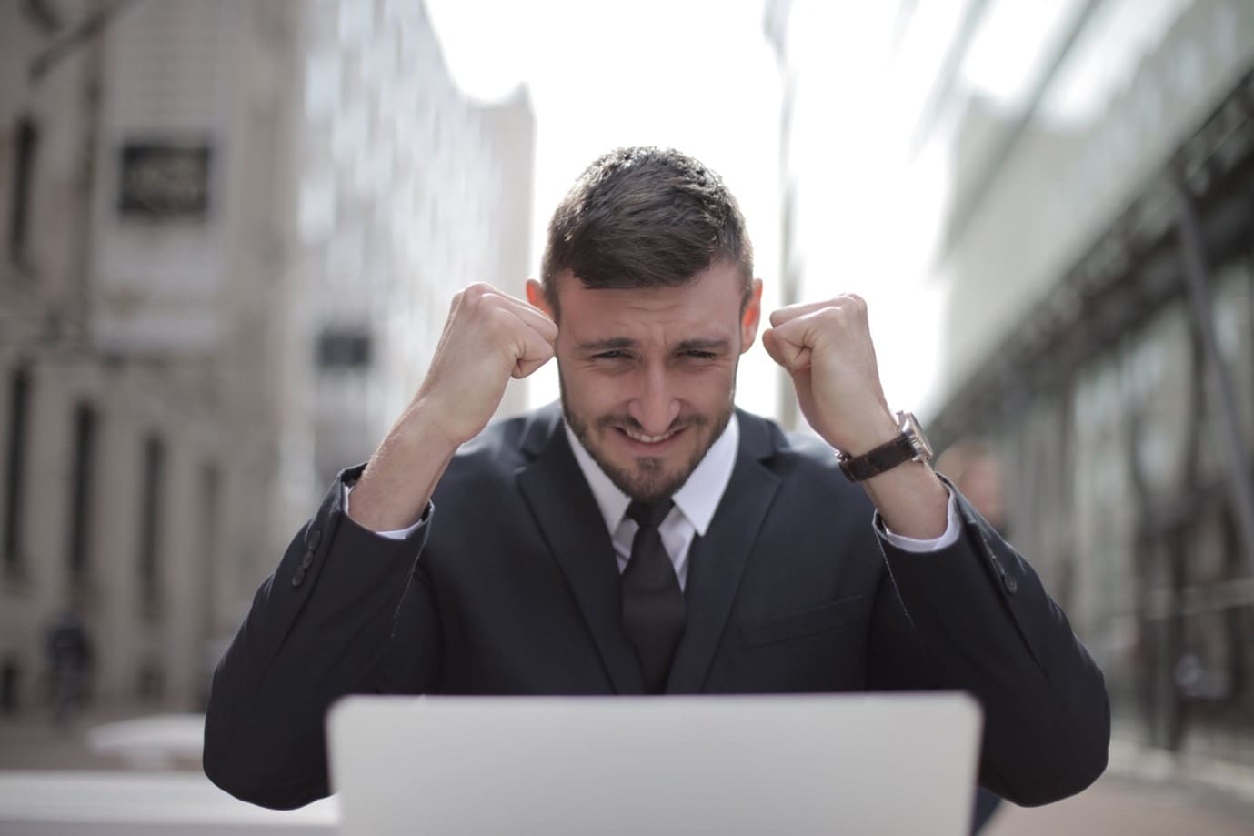 man celebrating his earning